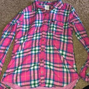 Plaid long sleeve or cardigan.